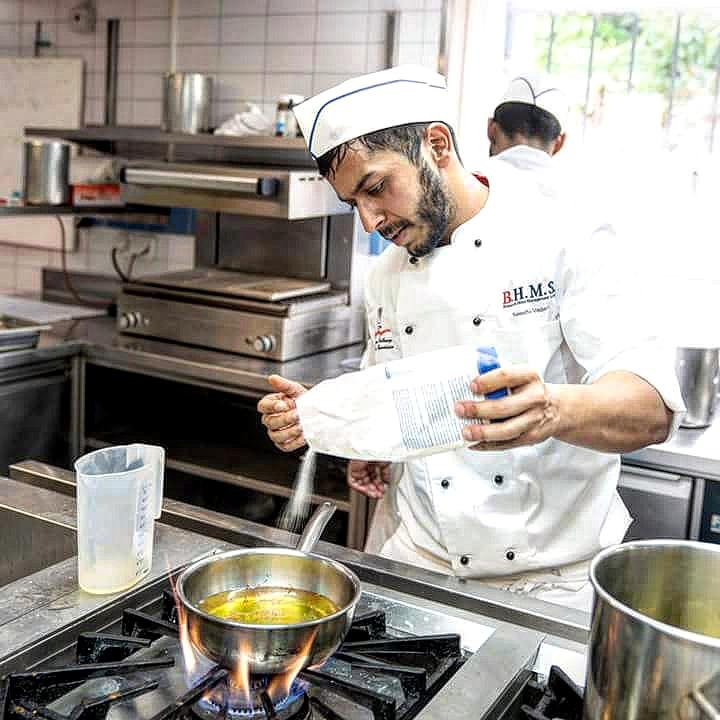 Chef Vedant Newatia working in a kitchen during his training years abroad